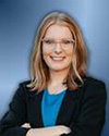 A person wearing glasses and a black jacket  AI-generated content may be incorrect.